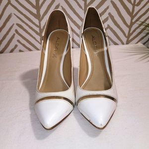 White patten leather pumps